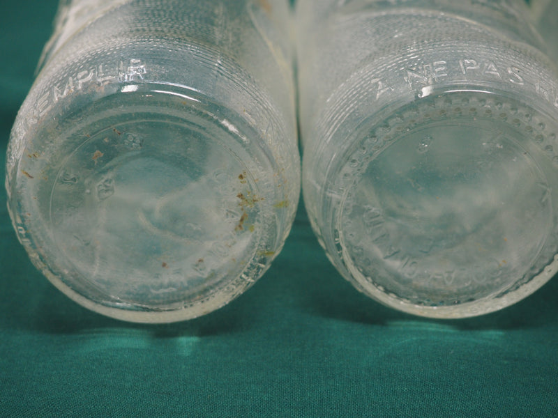 Four Vintage Coca-Cola Clear Straight Sided Bottles